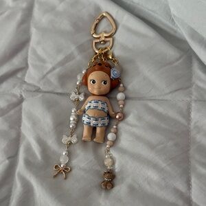 Cute Doll Keychain with Blue and Gold Details
